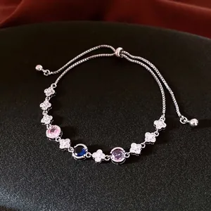 Adjustable clover bracelet with zircon flower and multicolor gemstones on black padding