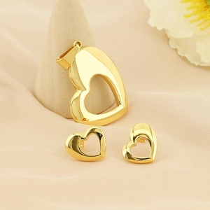 Elegant gold plated stainless steel jewelry set featuring heart pendant and earrings