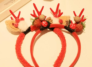 Detailed view of three Christmas reindeer antler headbands with plush faux mink fur and berries