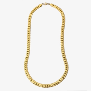Polished golden stainless steel Cuban link necklace with textured pattern on white background
