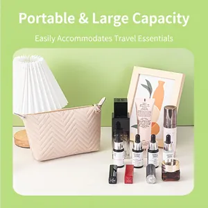 Portable dumpling shaped cosmetic bag with chevron quilting and large storage capacity