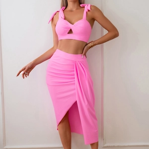 Hot pink three-piece bikini set with bow shoulder straps and high-waist side slit skirt