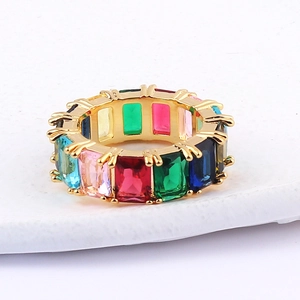Macro detail of gold rainbow ring with multi-colored rectangular cubic zirconia stones