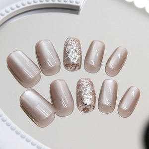 Short square cat eye press-on nails in nude pink with silver glitter on mirror base