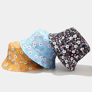 Floral reversible sun hats for women in yellow, blue and black with daisy patterns