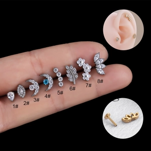 G23 titanium cartilage studs with leaf, moon, and flower zircon designs in silver