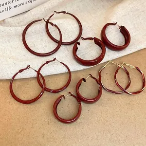 Burgundy red and gold twisted hoop earrings set with minimalist glossy finish for women
