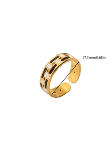 Detailed view of adjustable 18k gold ring with black and white enamel checkerboard pattern