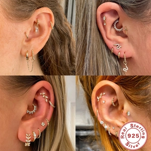 Detailed close-up of 925 sterling silver gold earrings with cubic zirconia inlay sets