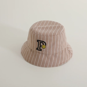 Detail of wool striped bucket hat with embroidered P letter and yellow smiley face logo