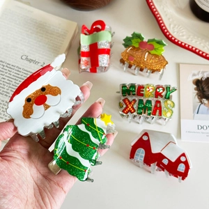 Festive Christmas hair claw clips set with glittery Santa, tree, and Merry Xmas designs
