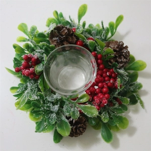 Christmas candle holder wreath with artificial red berries pine cones and snow