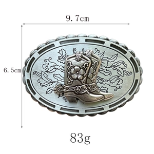 Detailed macro view of Western cowboy boot belt buckle with intricate floral carvings