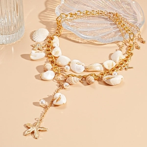 Ocean style multilayer gold necklace with seashell, pearl and starfish charms for beach