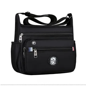 Micro side view of men's multi-pocket business messenger bag in black durable nylon fabric