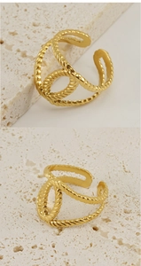 Detailed macro view of 18K gold plated hollow twisted rope ring with adjustable opening