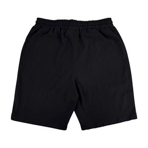 Detailed top-down view of black elastic waist casual beach shorts in breathable fabric