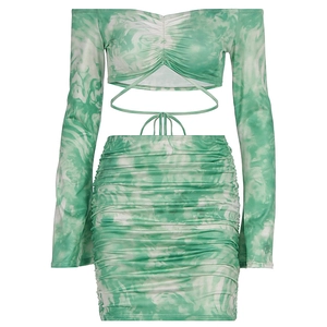 Detailed flat lay of green tie-dye two-piece set with tie-waist top and ruched skirt