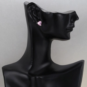 Pink heart-shaped zircon earrings with 18K gold plating shown on an ear model