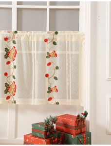 Close-up of Christmas bell embroidery on cream lace cafe curtain for window decor