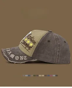 Close-up of distressed brim details and vintage embroidery on two-tone baseball cap