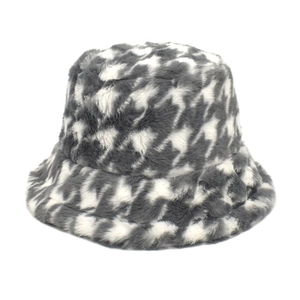 Detail shot of the plush houndstooth bucket hat showing soft faux fur material
