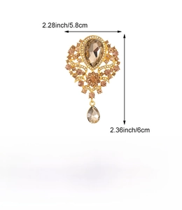 Detailed view of amber crown brooch showing dimensions 5.8cm by 6.0cm and alloy material