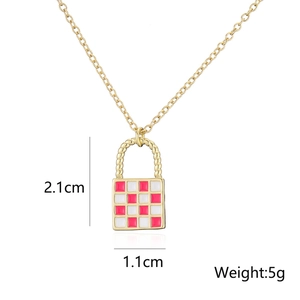 Detail showing dimensions of golden lock pendant necklace with red checkered enamel finish
