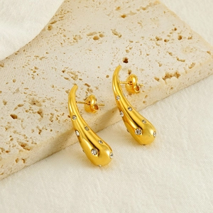 Luxury gold teardrop earrings with crystals on stone, stylish minimalist metal jewelry