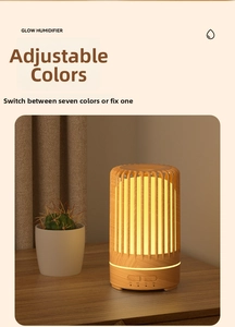 Detail of birdcage wood grain diffuser with colorful LED lighting and timer buttons