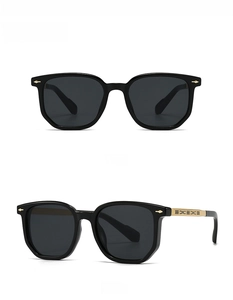 Detail view of retro square aviator sunglasses with black frame and gold metal hinges