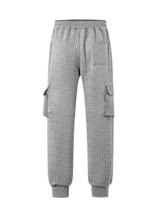 Detailed view of gray waffle textured fabric and cargo pocket on men jogger pants