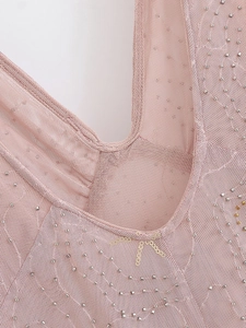 Detailed macro view of pink mesh midi dress showing V-neckline and silver sequin embroidery