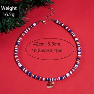 Detail of Christmas necklace with colorful clay beads and sparkling Santa hat pendant