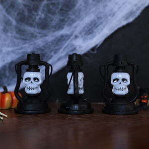 Halloween skeleton lantern set with LED lights on wooden surface with spider web decor