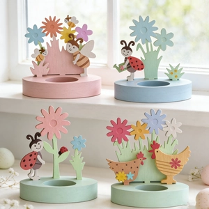 Pastel wooden Easter candle holders with floral, bee and hen carvings for spring decor