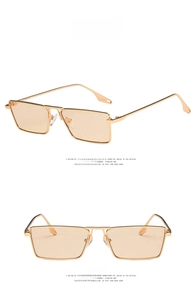 Detail of vintage square metal sunglasses with light brown lenses and double bridge design
