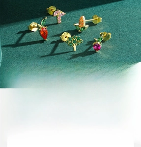 Detailed macro view of S925 sterling silver fruit stud earrings with colorful zircons