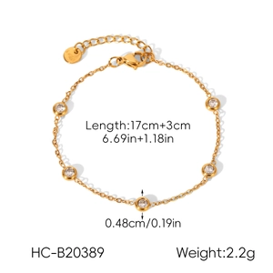 Detail view of gold heart zircon bracelet with length and weight specifications