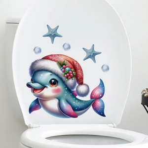 Close-up of a Christmas dolphin wall sticker with red hat and stars on a toilet lid