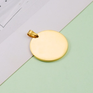 Polished golden stainless steel round pet tag charm with ring on minimalist background