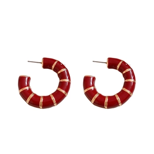 Vintage red enamel C-shaped hoop earrings with gold stripes in a minimalist design