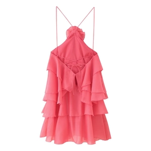 Detail of pink halter backless chiffon dress with layered ruffles and tie-back closure