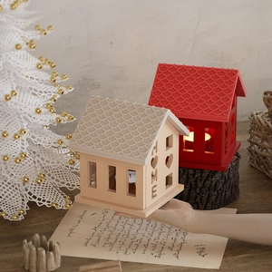 Detail of HOME house-shaped silicone mold lamp with heart cutouts and roof texture