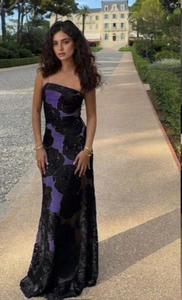 Close-up of elegant purple evening gown featuring black 3D floral lace and sleek silhouette