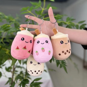 Close-up of four colorful milk tea plush charms with cute fruit and pearl embroidery