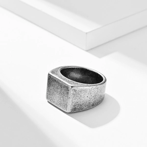 Vintage style square signet ring for men in distressed silver finish on white platform