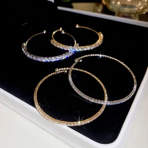 Luxury gold-plated round hoop earrings set with micro-pave crystals in tennis style
