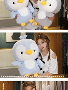 Close-up of soft plush penguin toys in light blue and grey with vibrant orange details