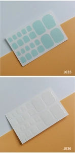 Detail view of J035 mint green and J036 white glitter self-adhesive toe nail sticker sets